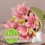 Lilies in Pink With Candle Offer Flowers